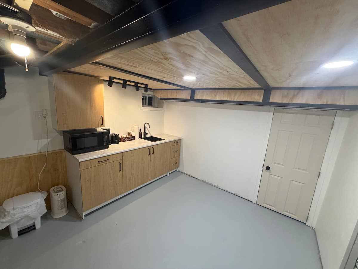 Kitchenette with sink, microwave and cabinets